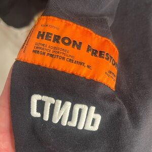 Heron Preston Black Top with Vibrant Orange Tag